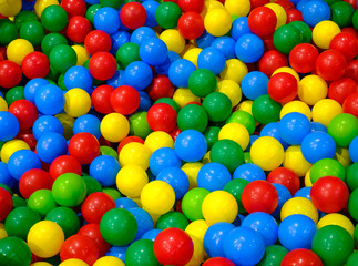 Fototapeta na wymiar Plastic balls in playroom background