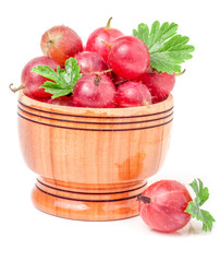 red gooseberries with leaf in wooden bowl isolated on white