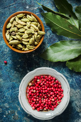 Spices on blue stone background with space for text.