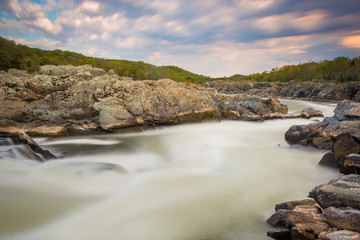 Fototapeta na wymiar Long exposure of rapids in the Potomac River at sunset, at Great