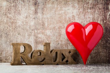 Relax. Message of home with wooden letters.