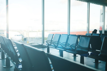 Empty airport interior. Empty seating at boarding gate at an airport. departure lounge