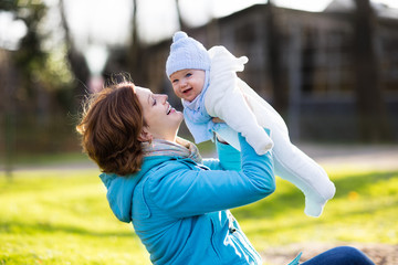 Mother and baby in autumn park