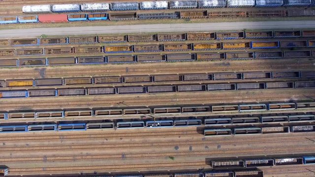Depot with many railways at day in city at sunny day. View from above.