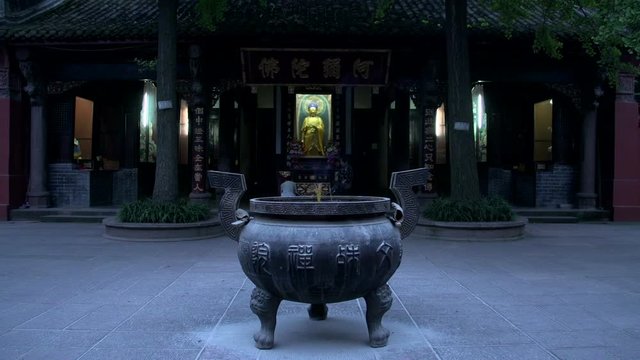 Blur people praying to buddha