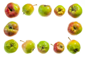 Fototapeta na wymiar Frame of whole apples on a white background