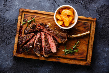 Sliced Medium rare barbecue Steak on bone Veal rib with potato w