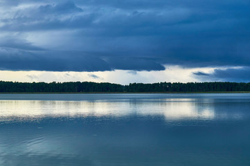 Obraz premium Dramatic Storm Clouds over beautiful Lemiet lake in Mazury district, Poland. Fantastic travel destination.