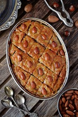 Turkish baklava on the wooden background, top view
