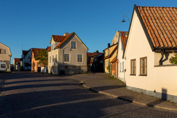 Street with typical buildings in the old town of Visby on the is