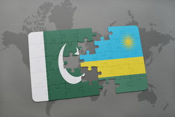 puzzle with the national flag of pakistan and rwanda on a world map background.
