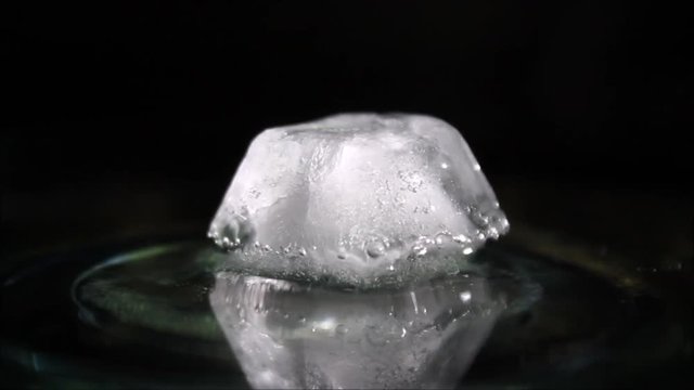 Melting ice cube air bubbles inside