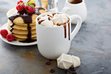 Hot chocolate with marshmallows and little meringues
