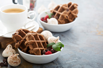 Chocolate waffles with meringues and coffee