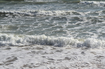 Beach summer sea waves detail in Algarve, Portugal