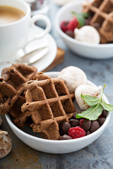 Fototapeta na wymiar Chocolate waffles with meringues and coffee