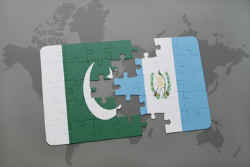puzzle with the national flag of pakistan and guatemala on a world map background.