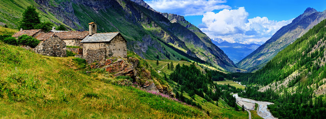 The old architecture with mountains on the panoramic view in Aosta - obrazy, fototapety, plakaty