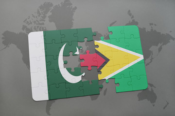 puzzle with the national flag of pakistan and guyana on a world map background.