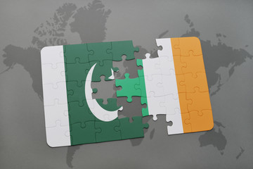 puzzle with the national flag of pakistan and ireland on a world map background.