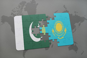 puzzle with the national flag of pakistan and kazakhstan on a world map background.