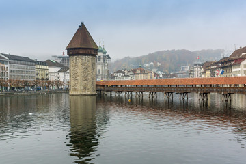 foggy morning and Chapel Bridge over Reuss River, Lucerne, Switzerland