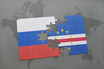 puzzle with the national flag of russia and cape verde on a world map background.
