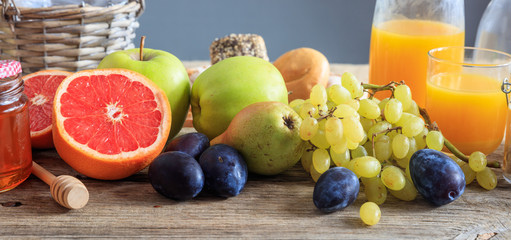 Variety of fresh fruits on a wooden table