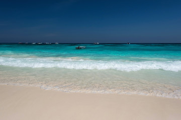 Water clear at the exotic beach with blue sky