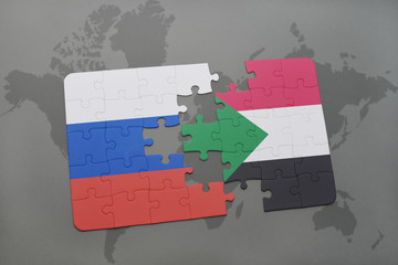 puzzle with the national flag of russia and sudan on a world map background.