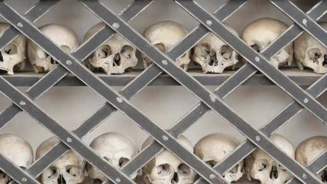 skulls placed on shelf into an ossuary at poschiavo switzerland tilt uhd 4k