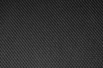 Black fishnet cloth material as a texture background. Nylon texture pattern or nylon background for design with copy space for text or image.