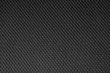 Black fishnet cloth material as a texture background. Nylon texture pattern or nylon background for design with copy space for text or image.