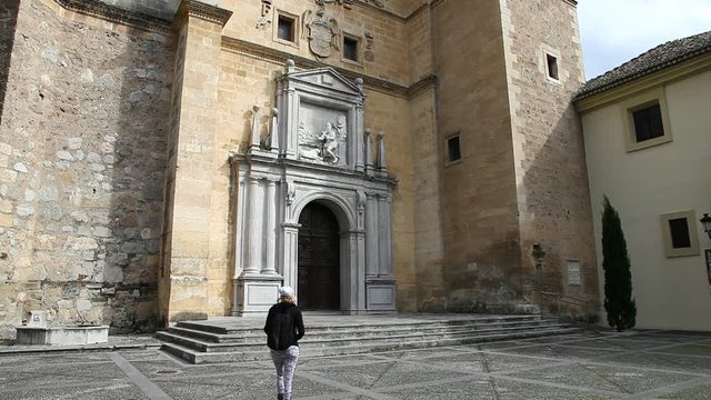 Tourist photographer taking pictures at facade of the Monastery de San Jeronimo, Granada, Andalucia, Spain.