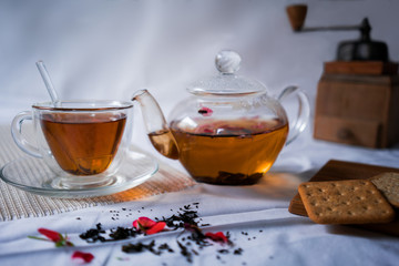 life style. teapot and cup of tea with a strong, fresh hand-mill  crackers on  table