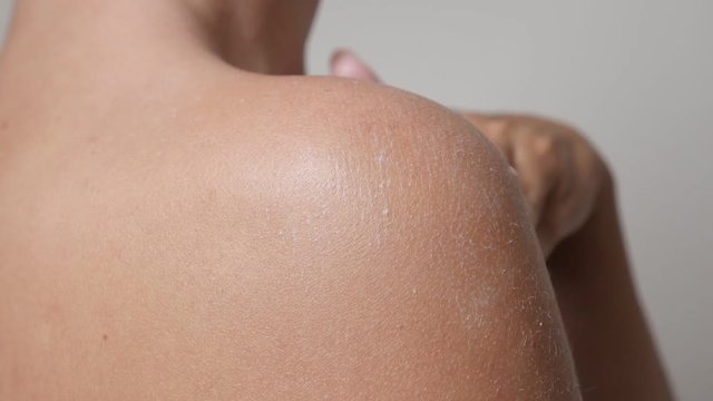 Caucasian female in slow motion applying body lotion on tanned back close-up 1920X1080 HD footage - Sensual woman moisturization of skin slow-mo 1080p FullHD video 