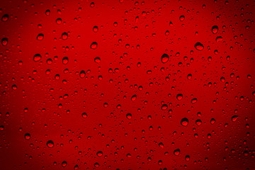 water drops of rain on red background