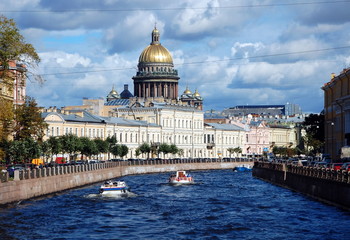 View of the embankment of the Moika River and St. Isaac's Cathedral, St. Petersburg, Russia 