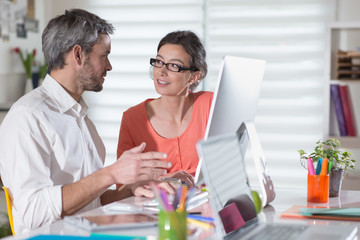 A nice couple, searching the internet on their computer