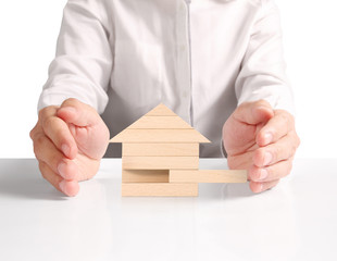 Mortgage concept by house from hand