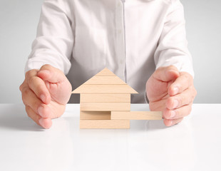 Mortgage concept by house from hand