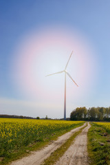 Bright blue sky moving and wind turbine