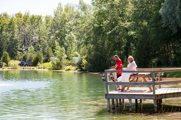 Wedding couple fishing on dock