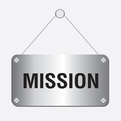 silver metallic mission sign hanging on the wall 