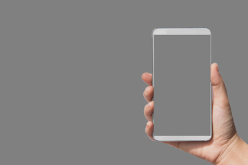 Fototapeta na wymiar Isolated female hand holding a phone with gray screen background