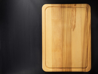cutting board at wooden table