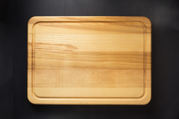 cutting board at wooden table