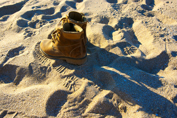 Hiking boots on sand