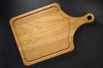cutting board at wooden table