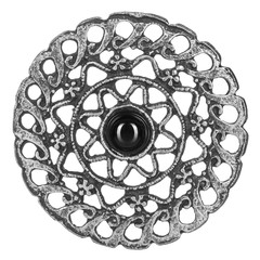 silver brooch with black agate on an isolated white background